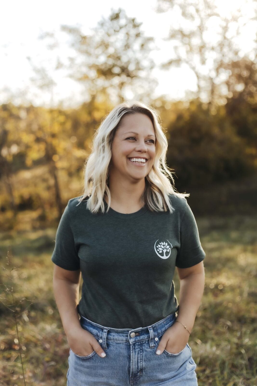 Angela Shields, Trufast office, smiling in a green Trufast t-shirt
