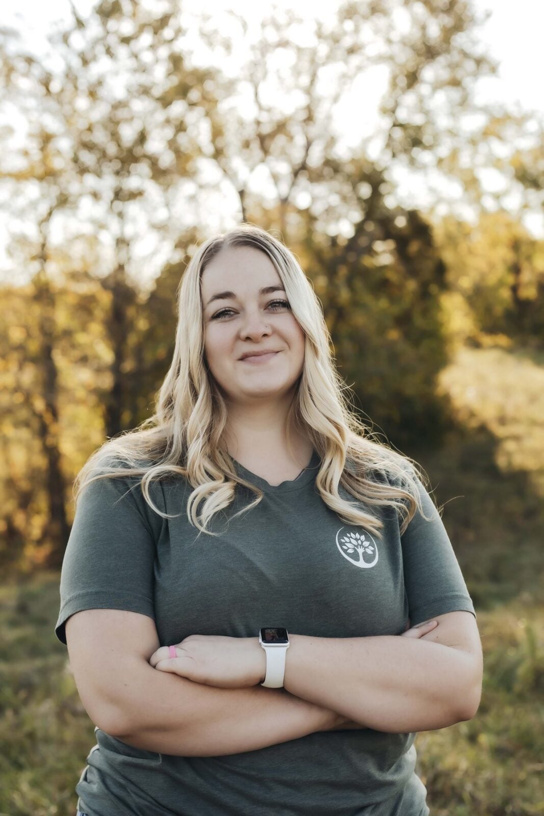 Kelsey Horsey, Trufast office, smiling in a green Trufast t-shirt