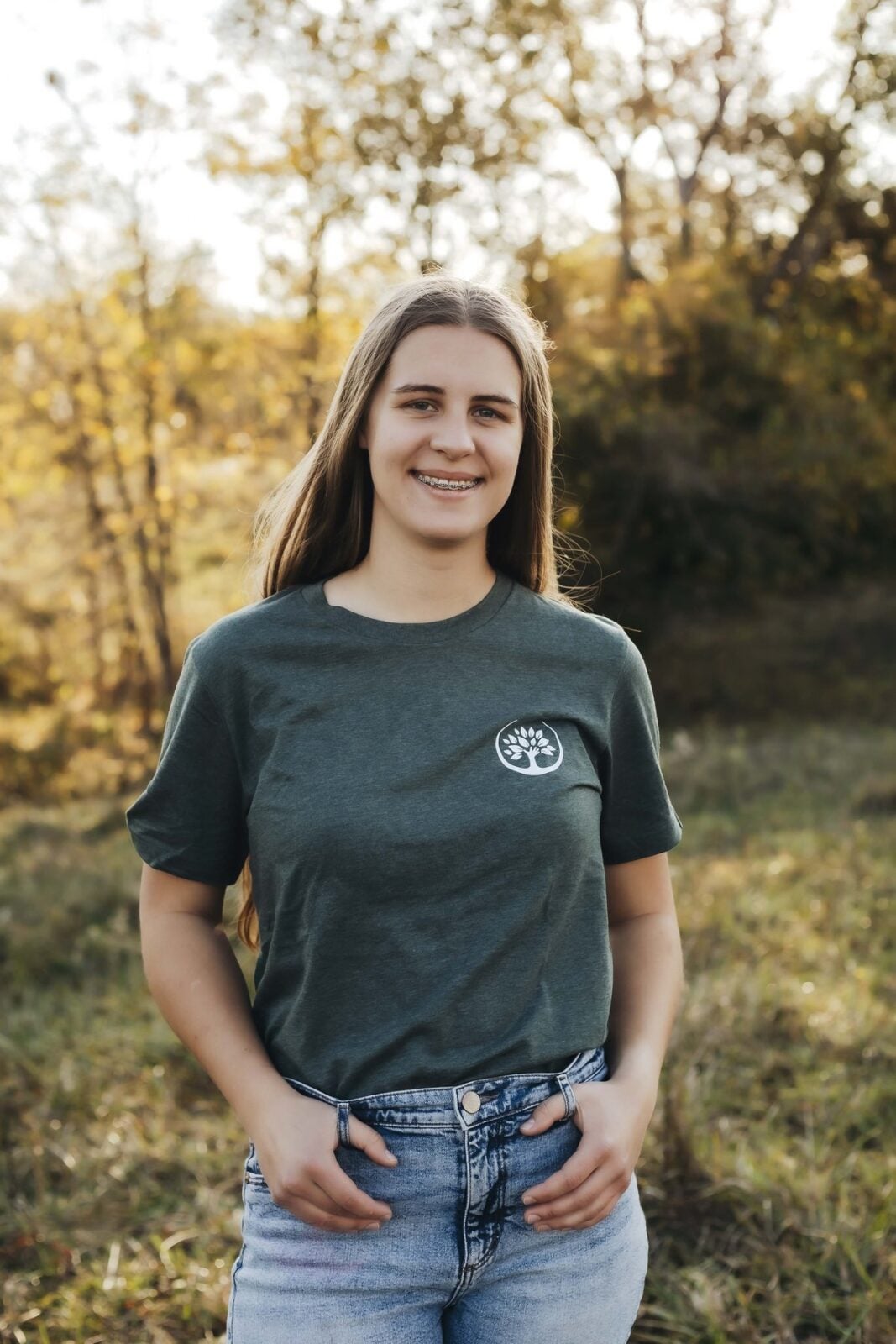 Natalie Theobald, Trufast office, smiling in a green Trufast t-shirt
